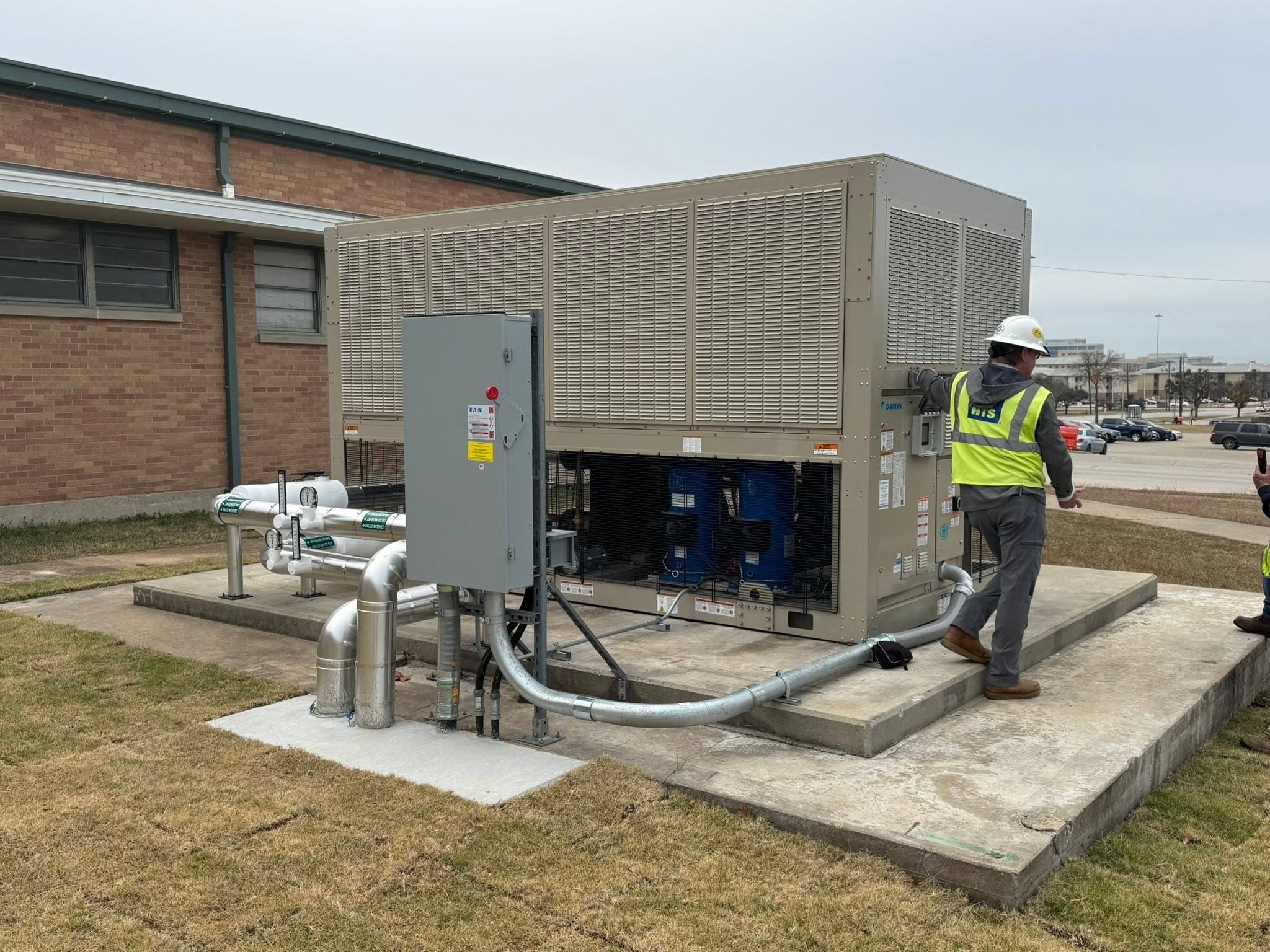 Seneca Mechanical technician working inside a commercial mechanical system