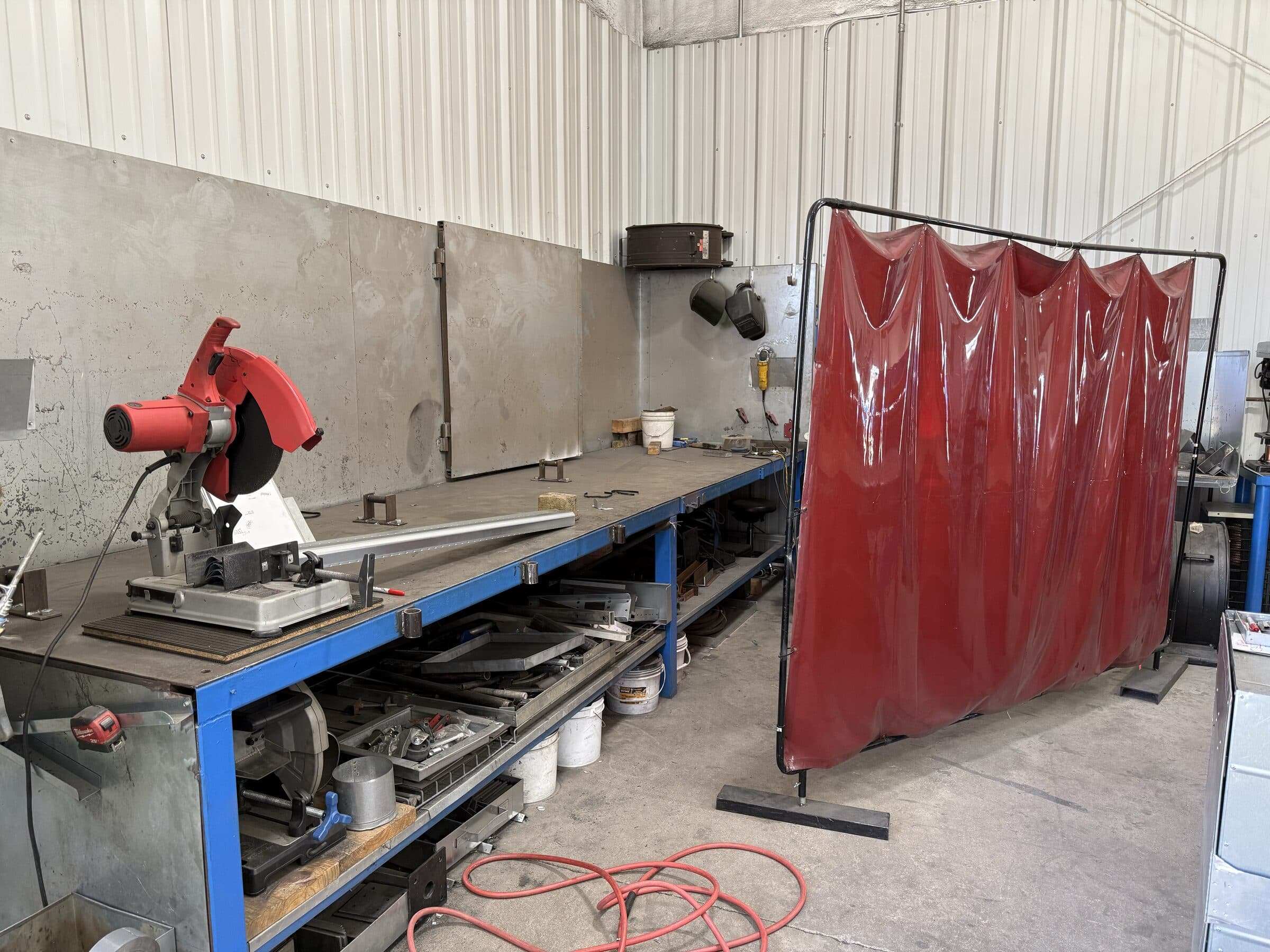 Organized workstations inside Seneca Mechanical's sheet metal shop
