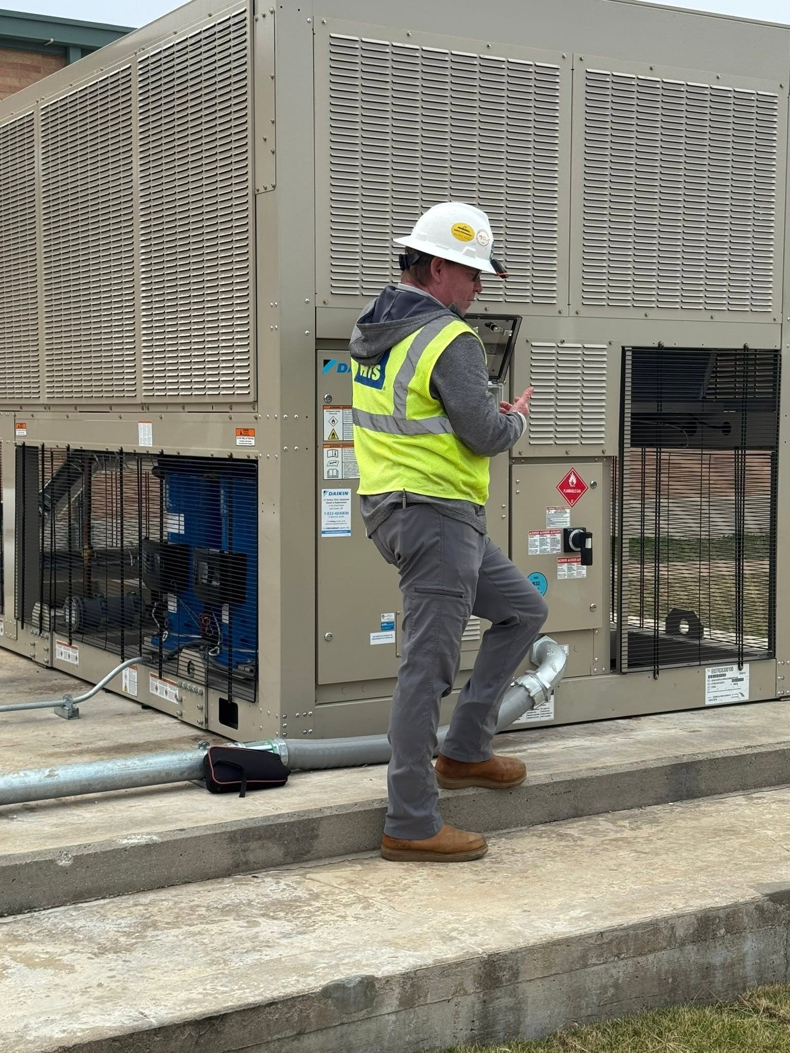 Seneca Mechanical technician performing commercial equipment maintenance